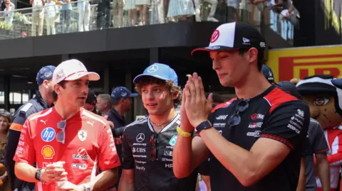 Charles Leclerc, Kimi Antonelli and Oliver Bearman chatting before the Monaco Grand Prix