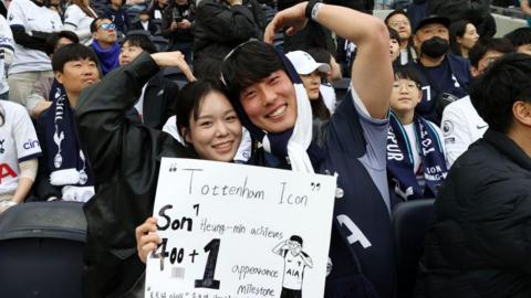 Fans hold up a sign showing support for Son Heung-min