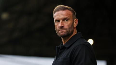 Ian Evatt looks on during his time in charge of Bolton Wanderers