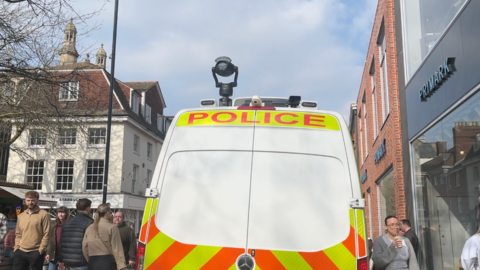 A facial recognition camera on top of a police van parked in Norwich city centre.
