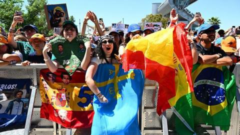 Fans with sings waiting for drivers to arrive in the Barcelona paddock 