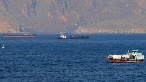 Ships and tankers in the Strait of Hormuz off the coast of Musandam, Oman, April 18, 2026.