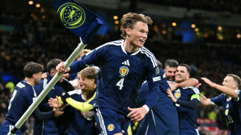 Scott McTominay celebrates Scotland reaching the World Cup