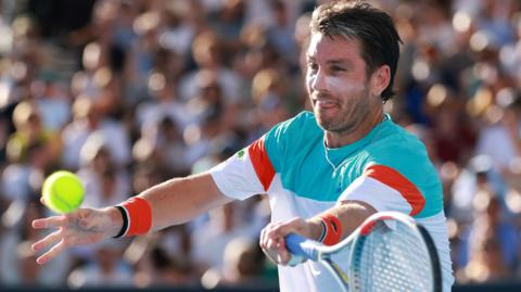 Cameron Norrie hits a forehand