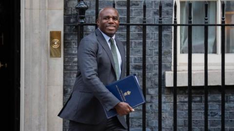 Deputy Prime Minister David Lammy in a blue suit outside Downing Street
