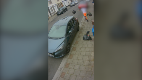 Binman leaving behind a rubbish bag on the pavement