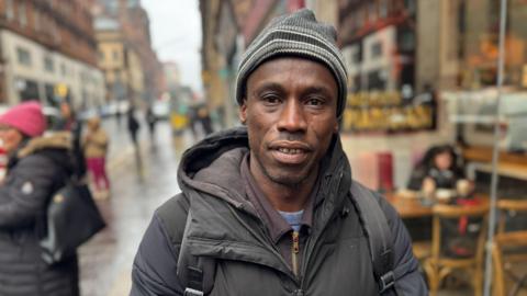 Lamin stood in Union Street the scene of the fire