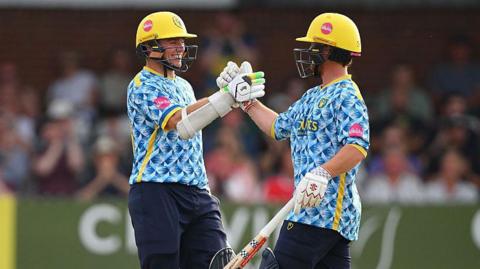 Tom Latham of Birmingham Bears celebrates his century during the Vitality Blast Men group stage match against Derbyshire Falcons
