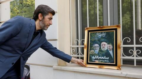 Tributes to Iran president left outside embassy
