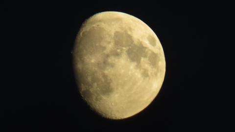 The nearly full Moon against a dark night sky