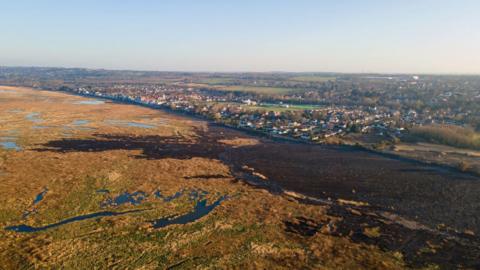 An aerial view shot of the marshland in Neston 