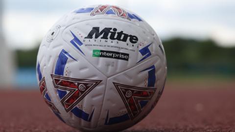 National League football on an athletics track