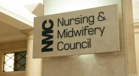 A sign that says "NMC: Nursing and Midwifery Council" on it on what appears to be its headquarters 