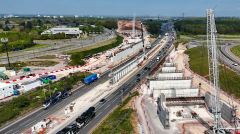 An aerial view of the preparatory work to install the structure that will carry the high speed rail line over the M42.