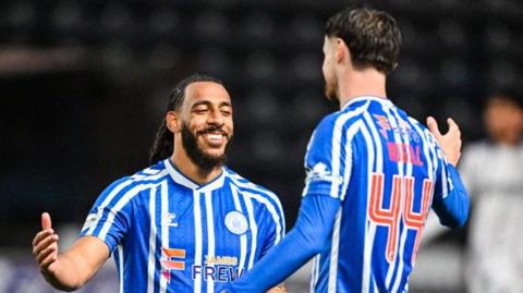 Dominic Thompson celebrates with Kilmarnock