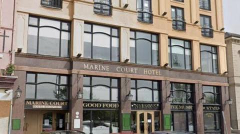 A google streetview image of the outside of the Marine Court Hotel in Bangor 