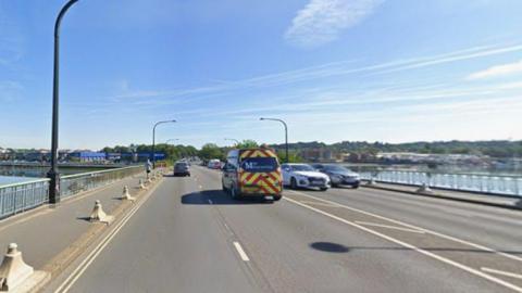 A view of Northam Bridge across the River Itchen in Southampton on a sunny day. Vehicles are driving both ways.