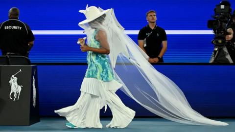 Naomi Osaka walking out at the Australian Open wearing an outfit inspired by a jellyfish.