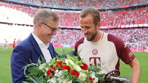 Bayern Munich chief executive Jan-Christian Dreesen (left) with England skipper Harry Kane