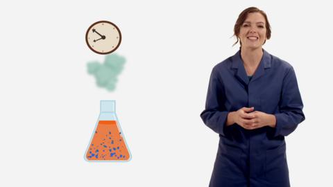 Presenter Fran Scott with a flask of reacting chemicals and a clock above measuring time.