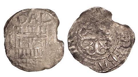 Two sides of a medieval grey coloured coin. One side depicts a crudely drawn castle, and the other a cross.