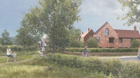 An artist's impression of the site shows new homes and paths and trees