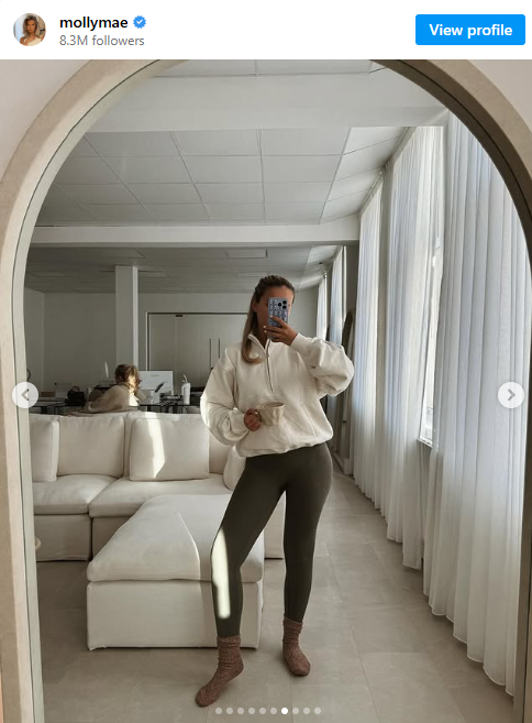 Molly-Mae's Instagram. She is posing in the mirror holding a mug