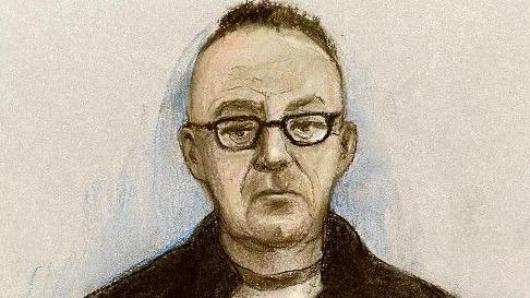 A court artist's sketch of Gary Poland. He has short dark hair, is wearing glasses and a dark jacket with a t-shirt underneath.