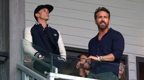 Rob McElhenney and Ryan Reynolds watch a Wrexham game