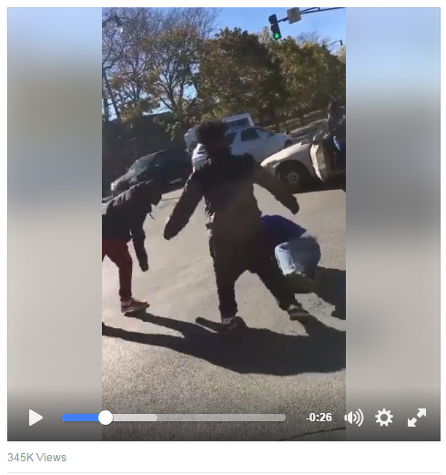 A still from the viral Facebook video showing men beating and robbing someone they accuse of being a Trump supporter after a traffic accident