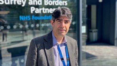 Graham Wareham standing outside the offices of Surrey and Borders NHS Partnership Trust