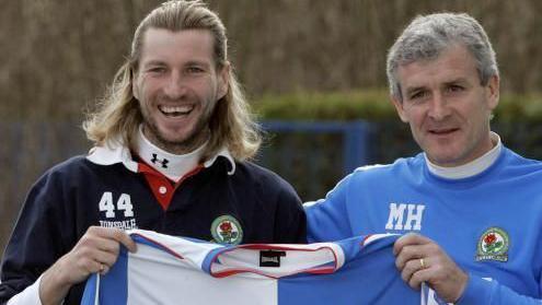 Footballer Robbie Savage posing with manager Mark Hughes after signing for Blackburn Rovers Football Club in 2005