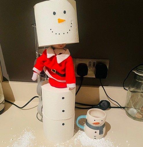 elf dressed as a snowman