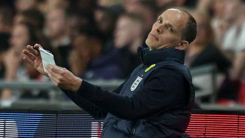 England head coach Thomas Tuchel, leaning back with arms out in front of him, looks frustrated during the defeat to Japan in the friendly at Wembley.