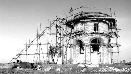 A black and white image showing scaffolding around Chesterton Windmill when repair work took place in the late 1960s and early 1970s.