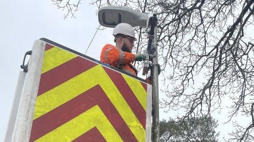 A man installing a thermal sensor