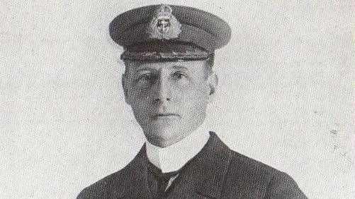 A black and white photo of a young man wearing a Royal Navy hat and uniform