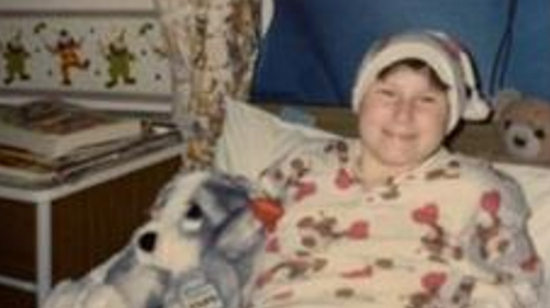 Louise Munckton in a hospital bed after her operation in 1999