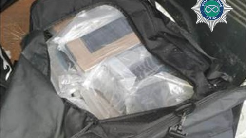 A black bag containing several blocks of cocaine