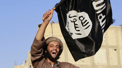 A militant islamist fighter takes part in an ISIS parade in Syria's eastern city of Raqqa June 30 2014