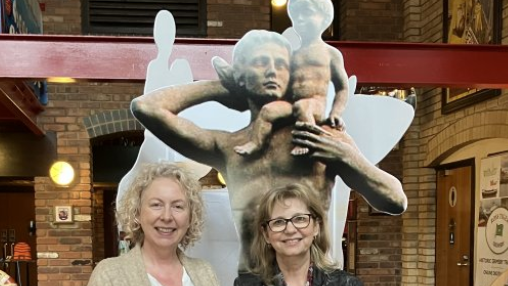 Jill Wilson and Tracey Todd with a cardboard cut out of Grim