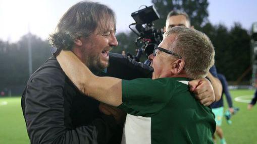 Craig Harrison and Mike Harris celebrate together