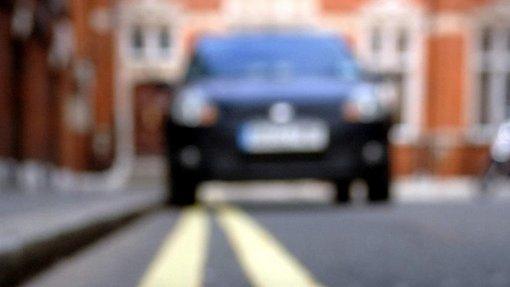 Car parked on double yellow lines