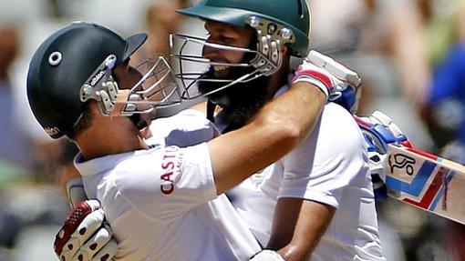 South African Dean Elgar, left, reacts with Hashim Amla