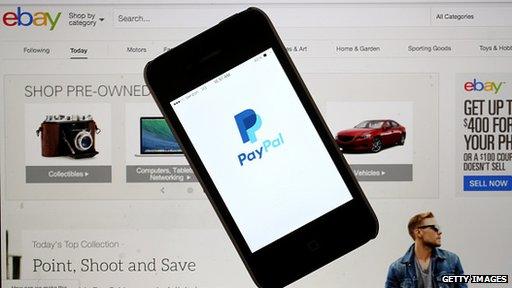 PayPal on phone in front of Ebay page