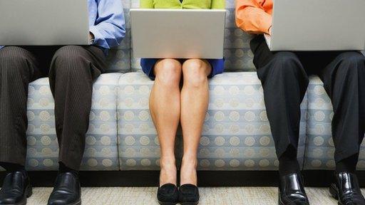 Men and a woman with laptops