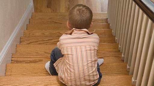 Boy sitting on the stairs