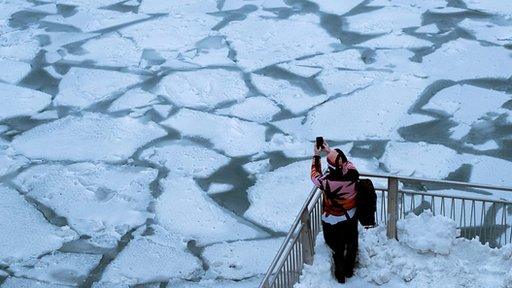 A woman by a frozen river