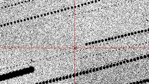 Black and white image showing how astromers pinpointed the asteroid with it highlighted in red