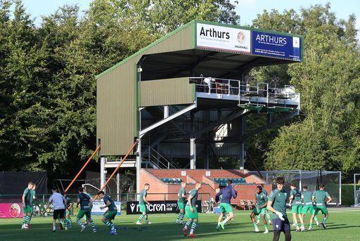 TNS player warm up in front of the gantry stand at Park Hall